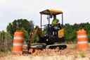 Mini excavator on site digging