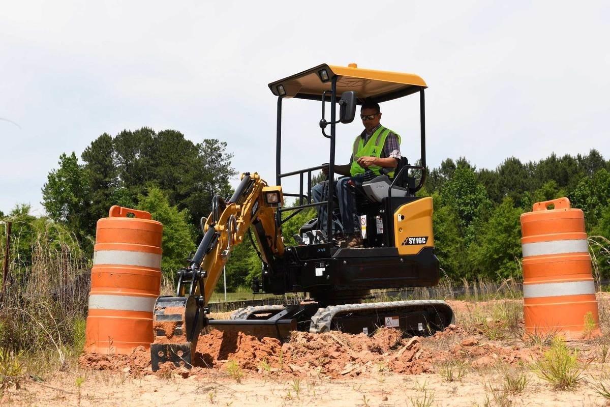 Mini excavator on site digging