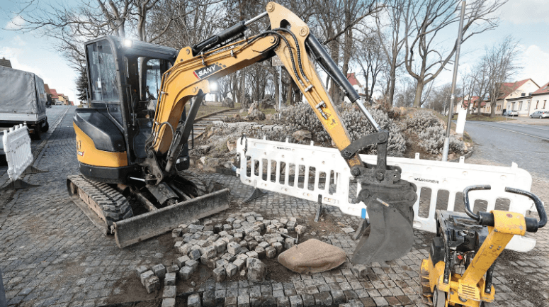 Excavator is pulling apart the cement