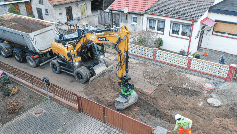 Excavator is scooping up the ground