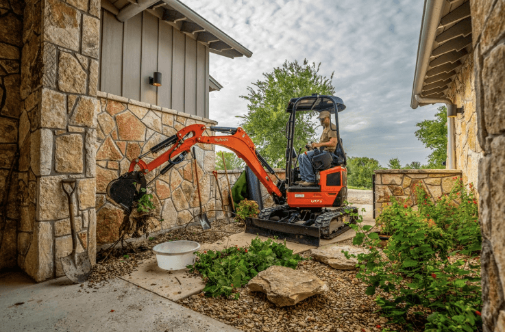 Mini Excavator doing landscaping 