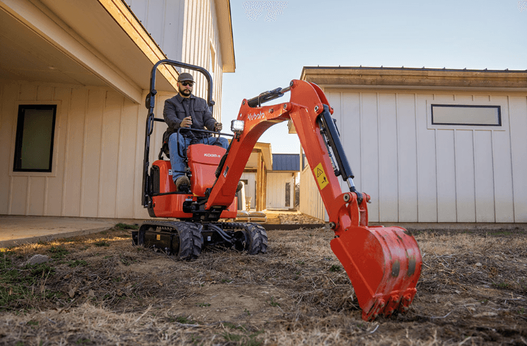 Man working a Mini Excavator