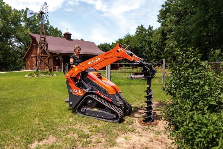 Kubota SCL1000 Stand-On Compact Loader with 9″ or 12″ Post Hole Digger