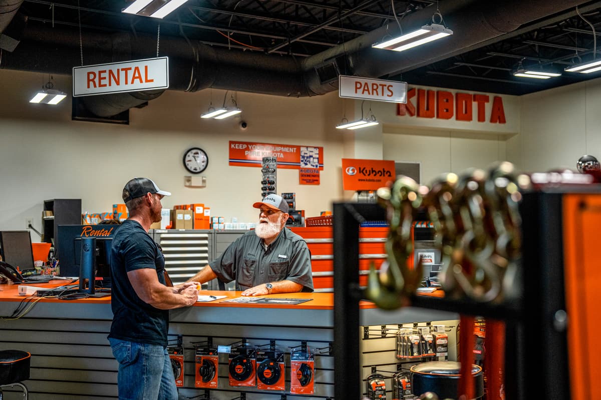 man at kubota rental counter